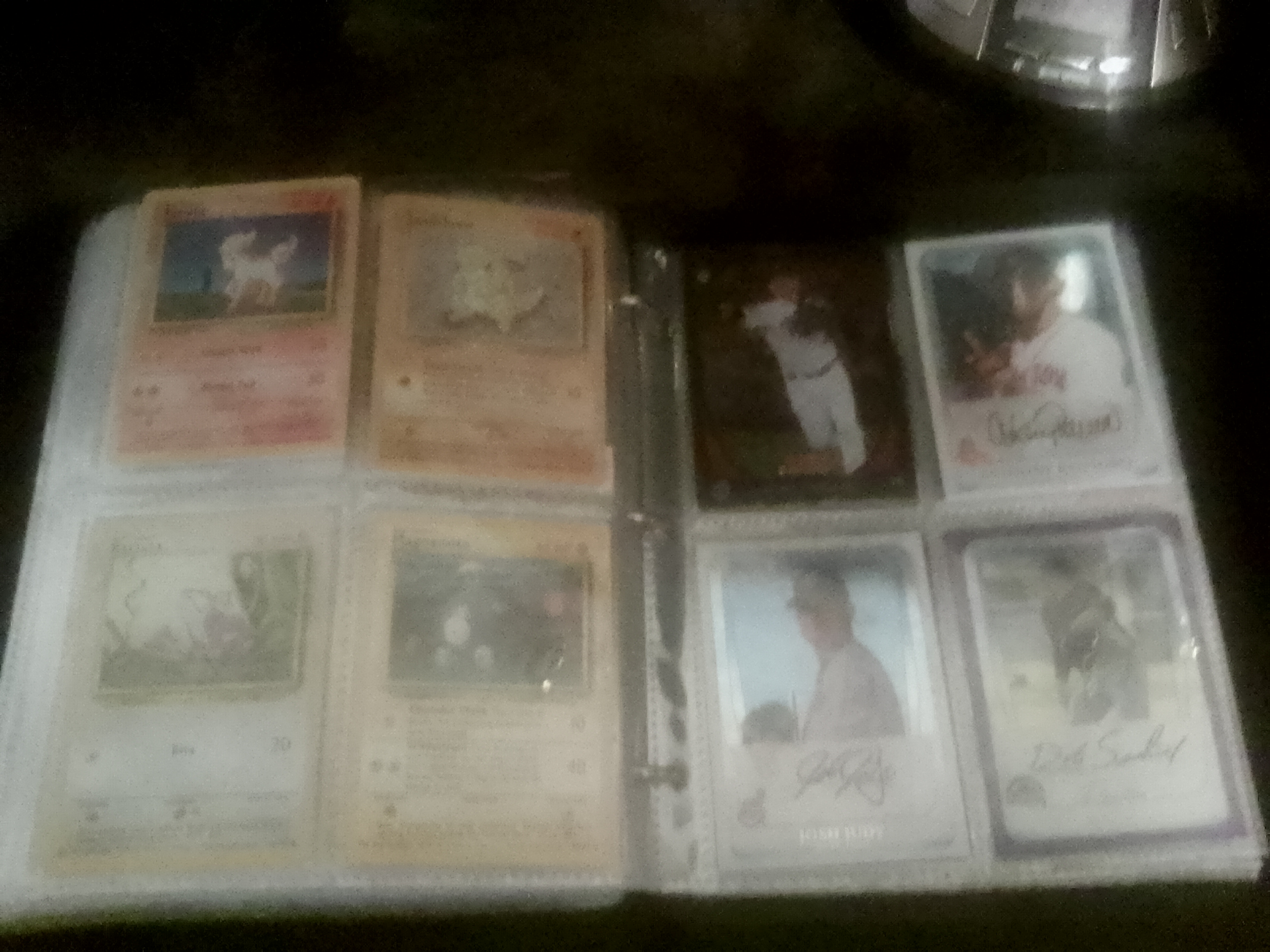 sport binder with Pokemon trading cards, baseball, football & basketball cards